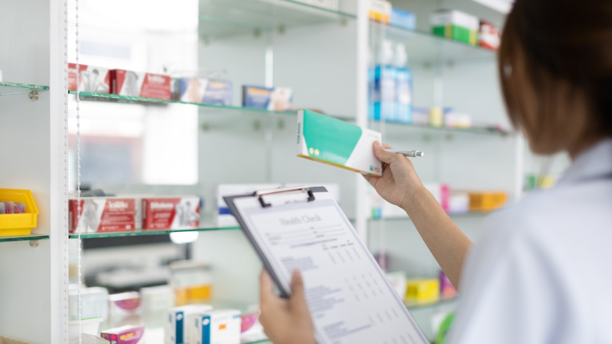 pharmacist checking a prescription 