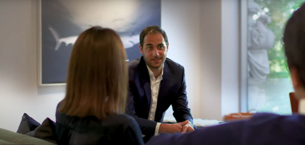 3 people talking in an office flex space